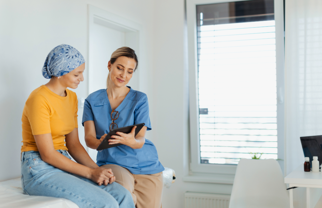 Oncology nurse reviewing a treatment plan with a patient